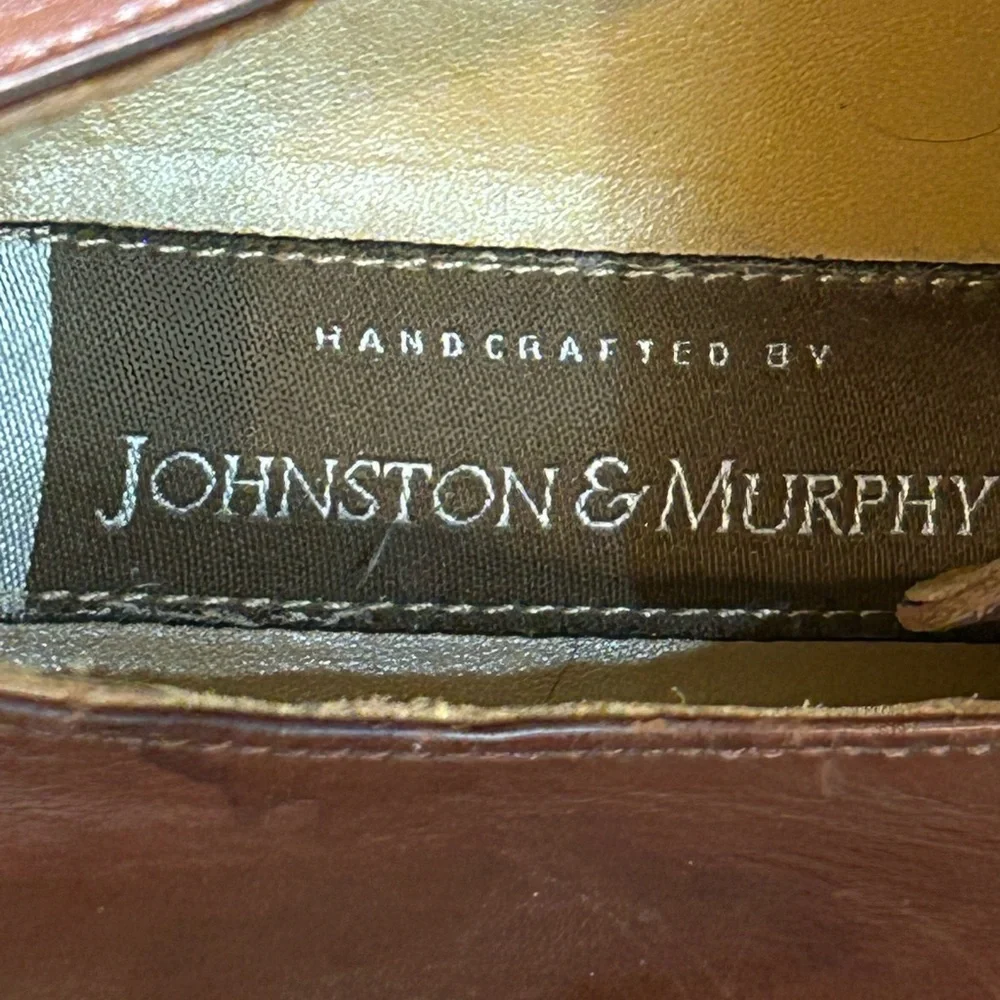 Johnston & Murphy brown leather split-toe derby dress shoe.